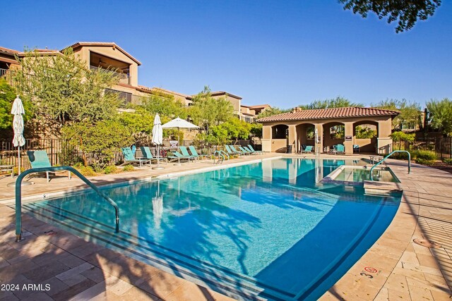 view of pool featuring a patio