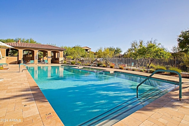 view of swimming pool featuring a patio