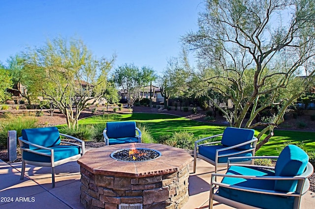 view of patio / terrace with an outdoor fire pit