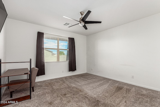 interior space featuring carpet and ceiling fan