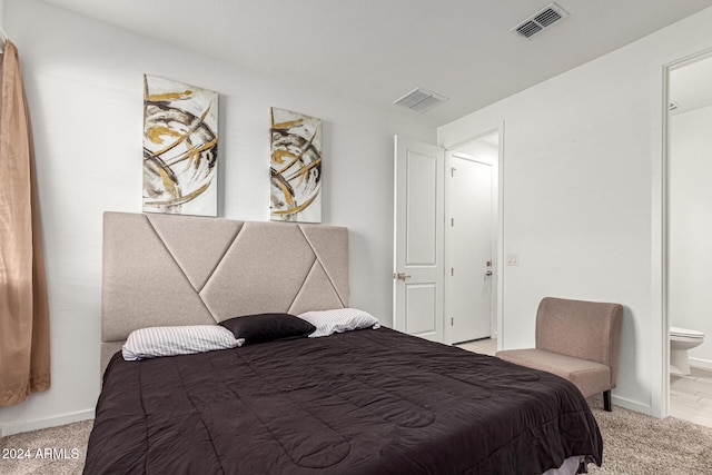 carpeted bedroom featuring connected bathroom