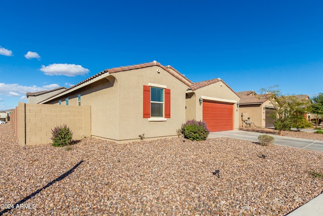 view of front of property with a garage