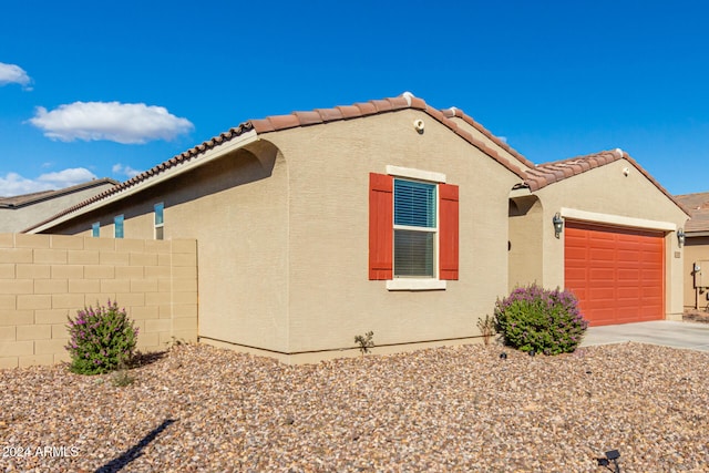 view of property exterior with a garage