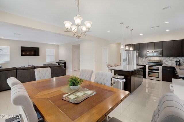 1502 E Goldcrest St, Gilbert, AZ 85297 - dining area featuring a chandelier, recessed lighting, and light tile patterned floors