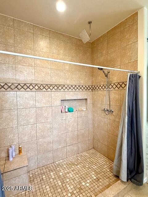 bathroom with a shower with curtain