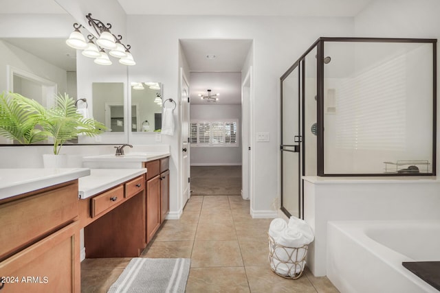 bathroom featuring vanity, independent shower and bath, and tile patterned flooring