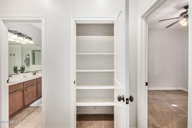 clothes washing area with light tile patterned floors and independent washer and dryer