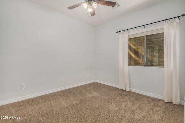 spare room with ceiling fan and carpet floors