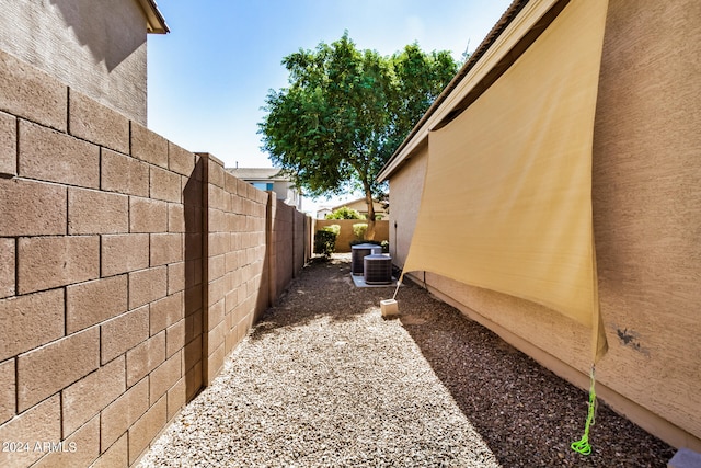 view of side of property featuring central AC unit