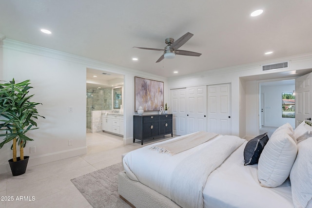 bedroom with connected bathroom, a closet, light tile patterned flooring, ceiling fan, and crown molding