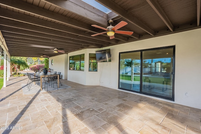 view of patio featuring ceiling fan