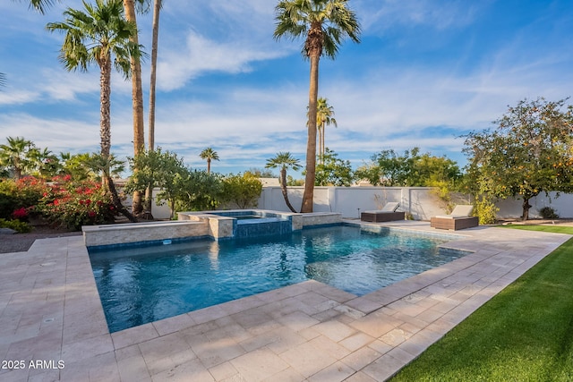 view of swimming pool featuring an in ground hot tub and a patio