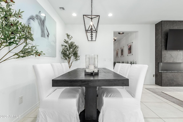 dining space with light tile patterned floors, visible vents, and recessed lighting