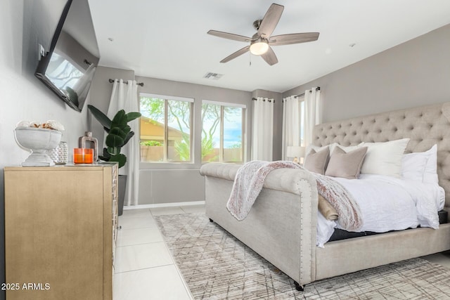 bedroom with light tile patterned floors, baseboards, visible vents, and a ceiling fan