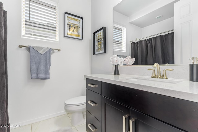 full bathroom with curtained shower, toilet, vanity, baseboards, and tile patterned floors