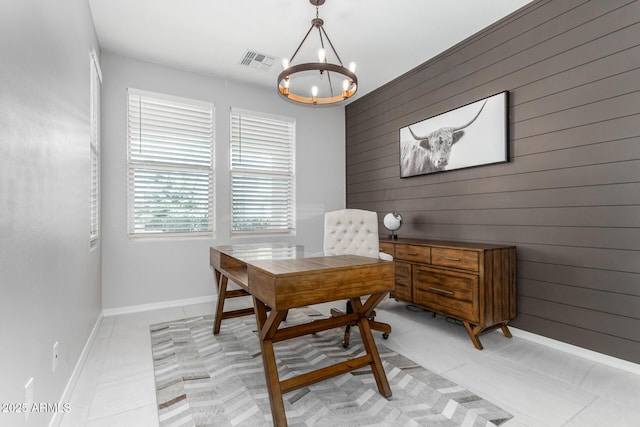 office space with visible vents, a notable chandelier, baseboards, and light tile patterned floors