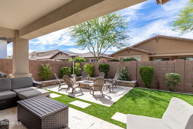 view of patio featuring an outdoor living space with a fire pit and a fenced backyard