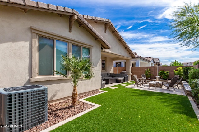 view of yard featuring an outdoor living space with a fire pit, central AC, a patio, and fence