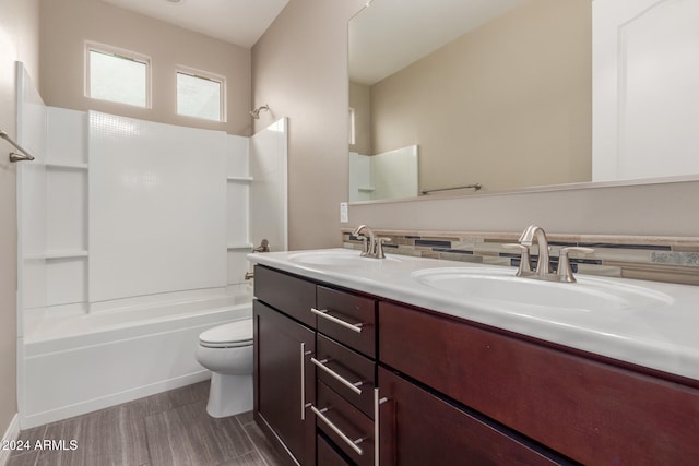 full bathroom with shower / tub combination, vanity, and toilet