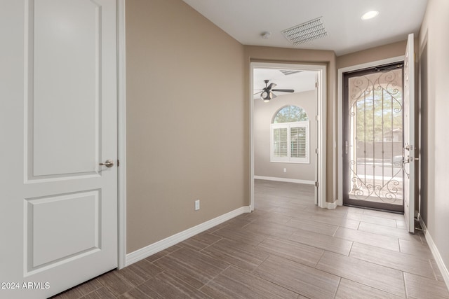 foyer featuring ceiling fan