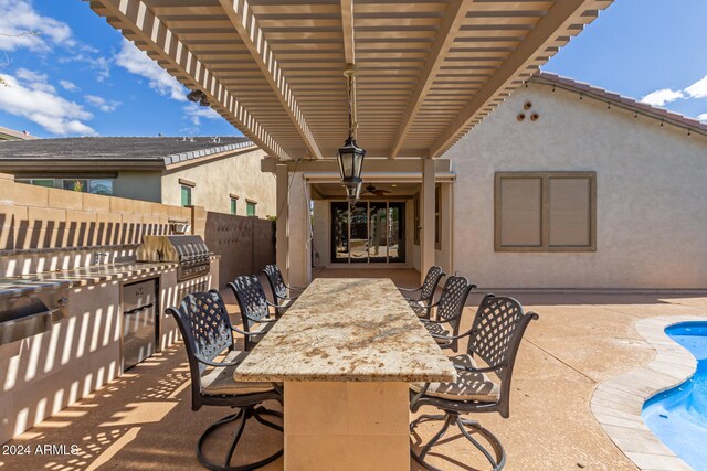 view of patio / terrace featuring a pergola, a grill, a bar, and ceiling fan