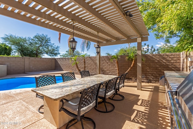 view of patio featuring a pergola and a fenced in pool