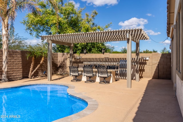 view of pool with a pergola and a patio area