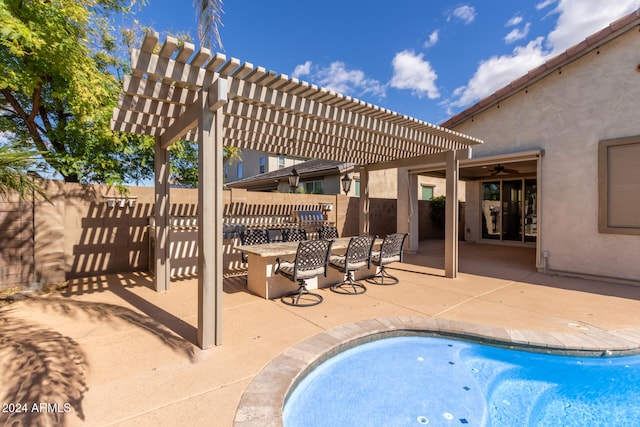 view of swimming pool featuring a pergola and a patio