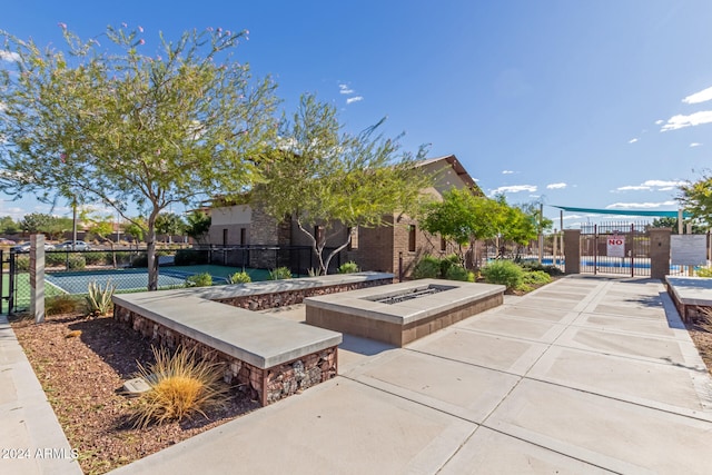 view of property's community with a fire pit