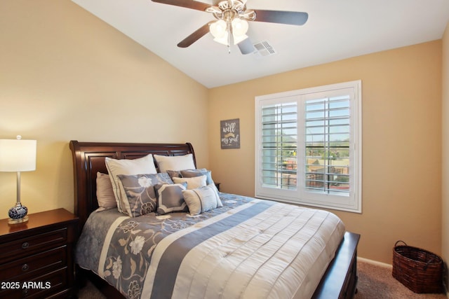 carpeted bedroom featuring ceiling fan and vaulted ceiling