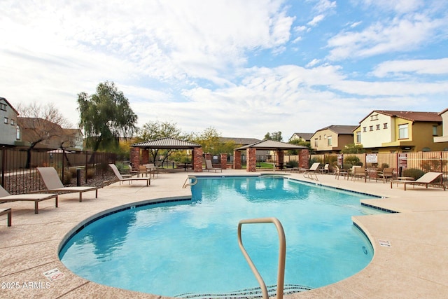 view of swimming pool featuring a gazebo and a patio