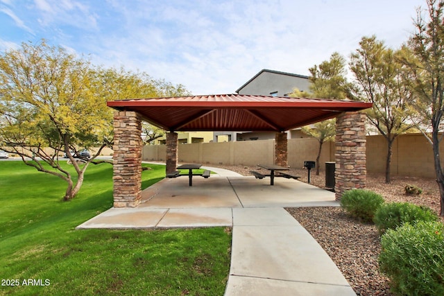 view of community with a gazebo, a patio, and a lawn