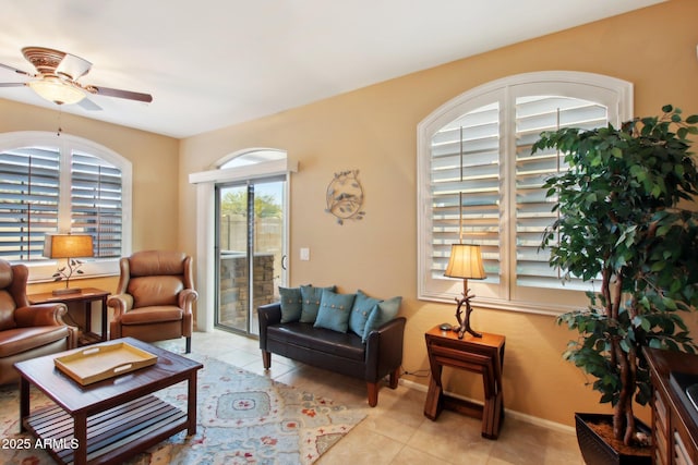 tiled living room with ceiling fan