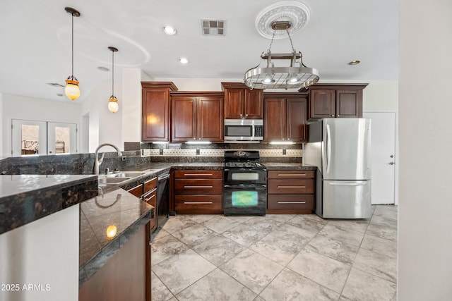 3850 E Geronimo St, Gilbert, AZ 85295 - kitchen featuring stainless steel appliances, hanging light fixtures, decorative backsplash, and recessed lighting