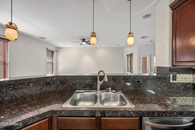 3850 E Geronimo St, Gilbert, AZ 85295 - kitchen with stainless steel dishwasher, decorative light fixtures, ceiling fan, and tile countertops