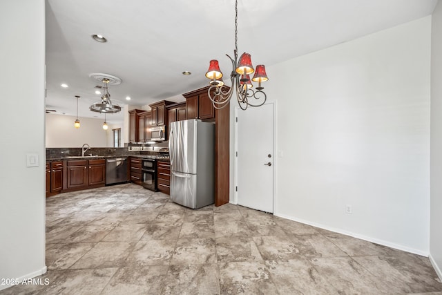 3850 E Geronimo St, Gilbert, AZ 85295 - kitchen with stainless steel appliances, a chandelier, hanging light fixtures, and backsplash