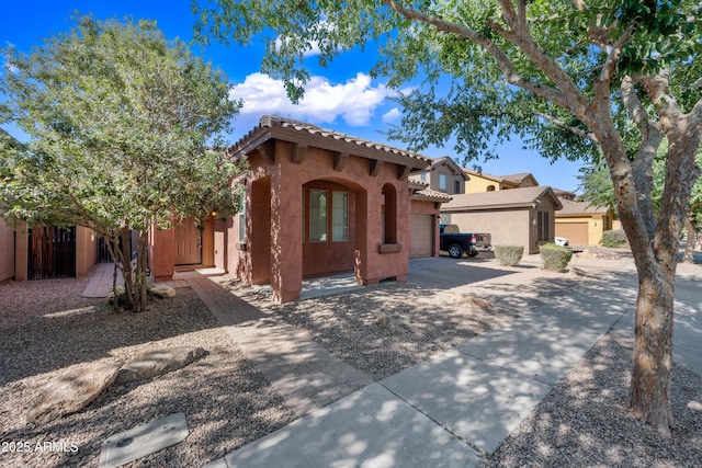 3850 E Geronimo St, Gilbert, AZ 85295 - mediterranean / spanish-style home with an attached garage, stucco siding, driveway, and a tiled roof