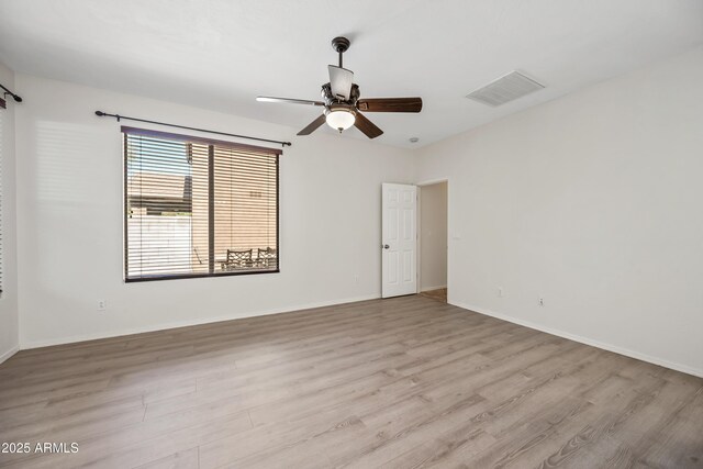 3850 E Geronimo St, Gilbert, AZ 85295 - unfurnished room with wood finished floors and a ceiling fan