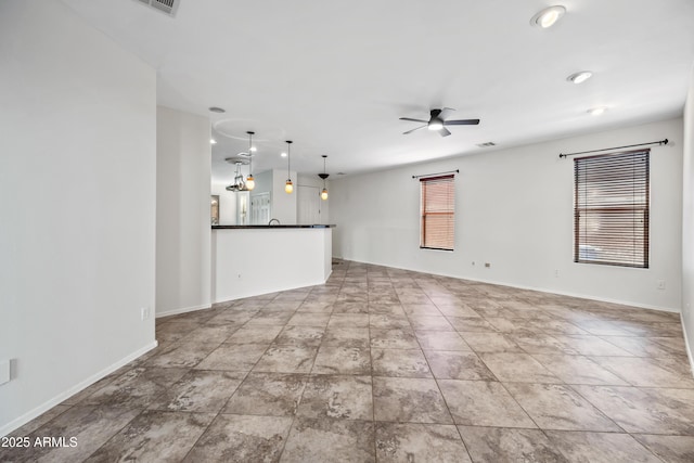3850 E Geronimo St, Gilbert, AZ 85295 - unfurnished living room featuring ceiling fan and baseboards