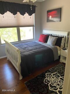 bedroom with hardwood / wood-style floors