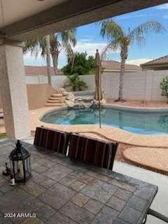 view of pool featuring a patio