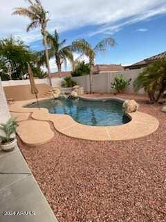 view of swimming pool with a patio area