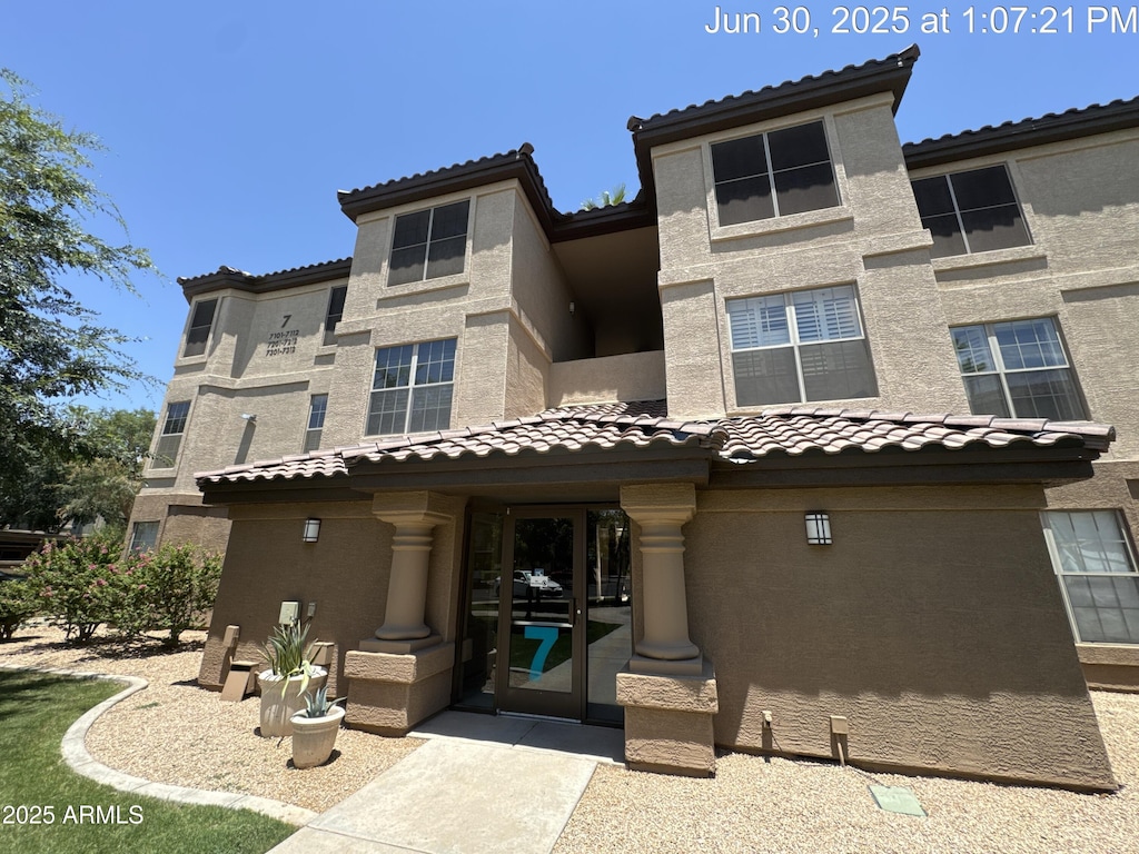 14950 W Mountain View Blvd Unit 7202, Surprise, AZ 85374 - view of front facade featuring a tile roof and stucco siding