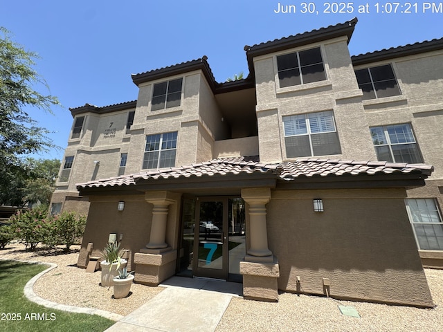 14950 W Mountain View Blvd Unit 7202, Surprise, AZ 85374 - view of front facade featuring a tile roof and stucco siding