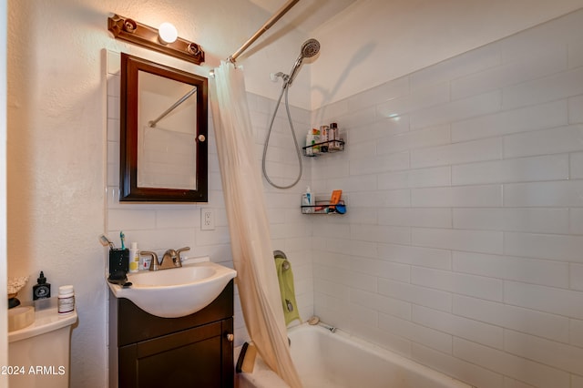 full bathroom with shower / bath combination with curtain, vanity, and toilet