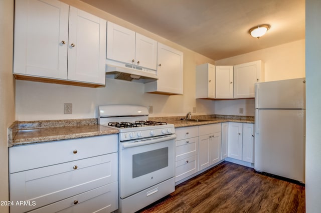 kitchen with white cabinetry, light stone countertops, white appliances, dark hardwood / wood-style floors, and sink