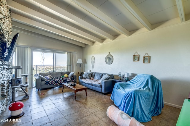 tiled living room with lofted ceiling with beams