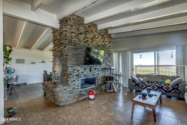 living room featuring tile flooring, a fireplace, and vaulted ceiling with beams