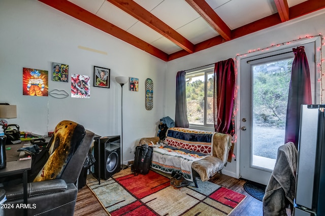 home office featuring beamed ceiling and dark hardwood / wood-style floors