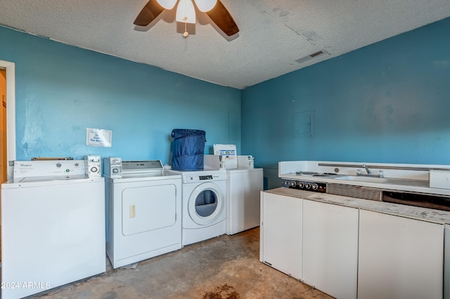 washroom with separate washer and dryer, ceiling fan, and a textured ceiling